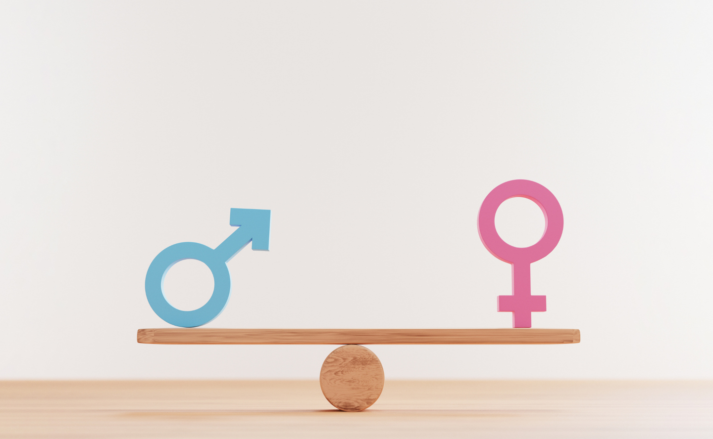 Un símbolo de masculino y un símbolo de femenino, en equilibrio sobre un plano sostenido por una esfera.